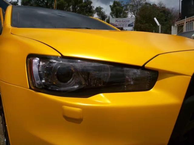 三菱EVO电光黄车身改色贴膜效果图